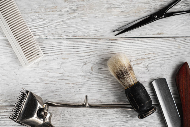 vintage barber tools dangerous razor hairdressing scissors old manual clipper comb shaving brush. - 写真・画像