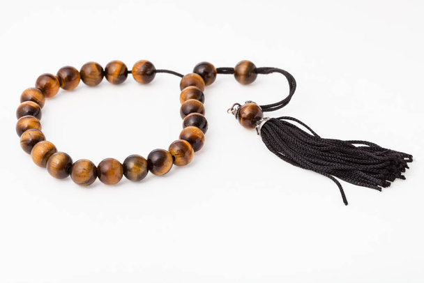 worry beads from tiger's eye gemstones on white - Photo, Image