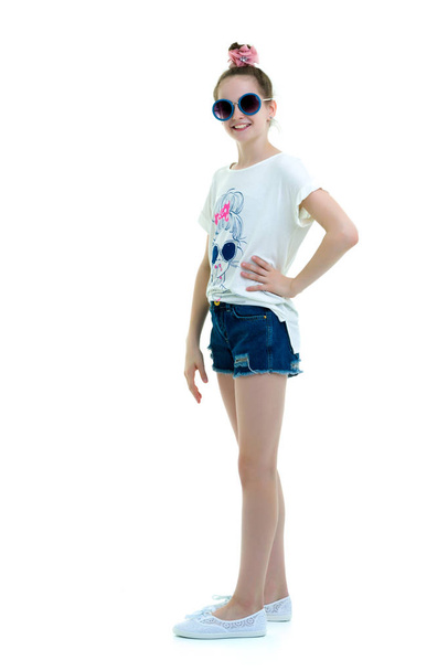 Little girl in sunglasses.The concept of youth fashion and style - Fotografie, Obrázek