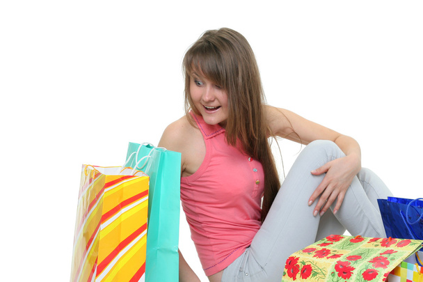 The beautiful girl with purchases - Foto, afbeelding