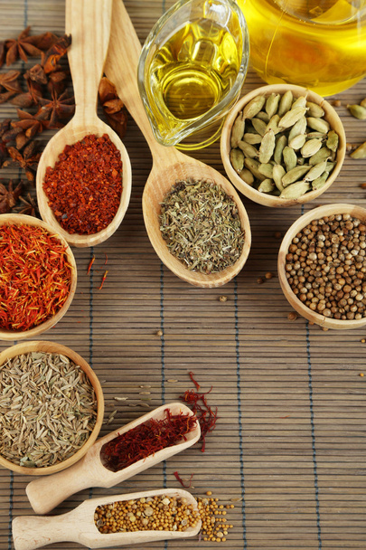 Many different spices and fragrant herbs on wooden table close-up - Foto, Imagem