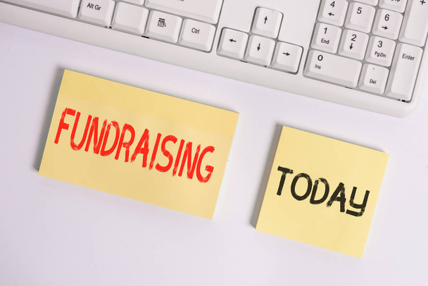 Text sign showing Fundraising. Conceptual photo act of collecting or producing money for a particular purpose Flat lay above blank copy space sticky notes with business concept. - Photo, Image