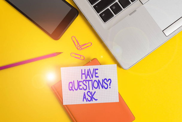 Conceptual hand writing showing Have Questionsquestion Ask. Business photo showcasing something that you say or write to ask a demonstrating Laptop smartphone clip pencil paper sheet colored backgroun - Photo, Image