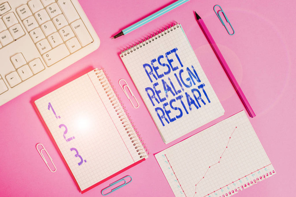 Handwriting text writing Reset Realign Restart. Concept meaning Life audit will help you put things in perspectives Writing equipments and computer stuffs placed above colored plain table. - Photo, Image