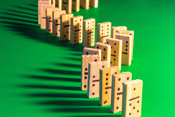 Wooden Dominoes with Long Shadows Standing Up - 写真・画像