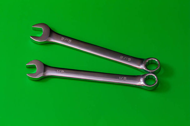 Pair of Steel Wrenches on Solid Green - Photo, Image