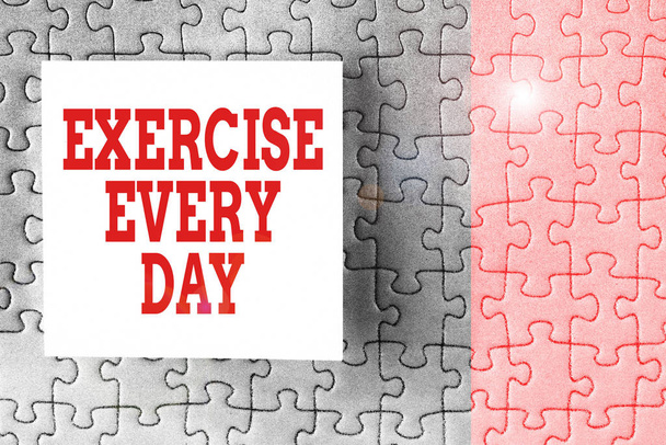 Text sign showing Exercise Every Day. Conceptual photo move body energetically in order to get fit and healthy Piece of square note paper use for give notation stick to puzzle background. - Photo, Image