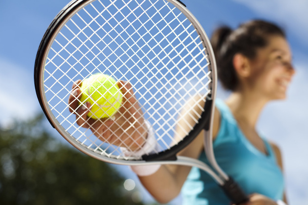Woman playing tennis in summer - Фото, зображення