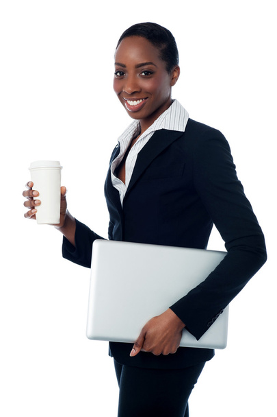 Employer holding laptop and beverage - Фото, зображення