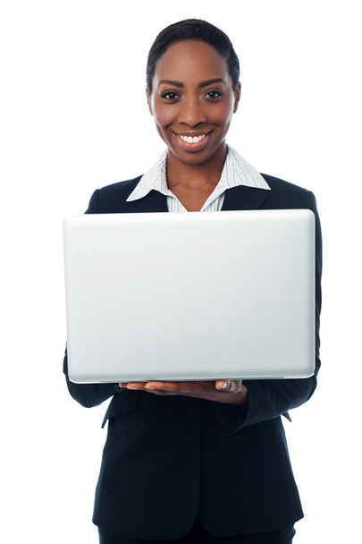 Corporate lady holding brand new laptop - Zdjęcie, obraz