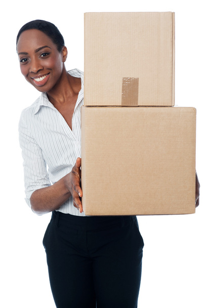 Woman holding cardboard boxes - Foto, afbeelding