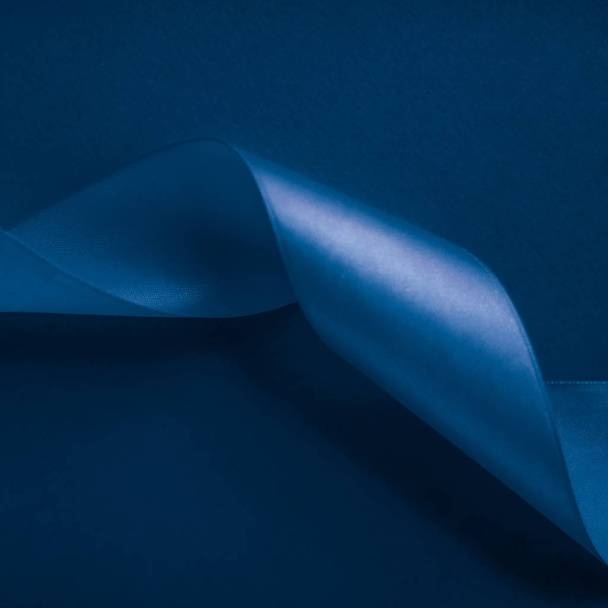 Abstract silk ribbon on royal blue background, exclusive luxury  - Fotó, kép