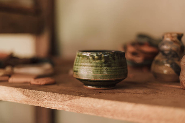 Clay pottery ceramic Products dry on shelf in workshop - 写真・画像