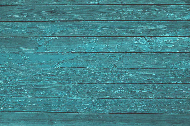 Green old wooden texture background. Scratched weathered blue wooden wall with peeled off paint close up. Horizontal wooden boards. Copy space - Photo, Image
