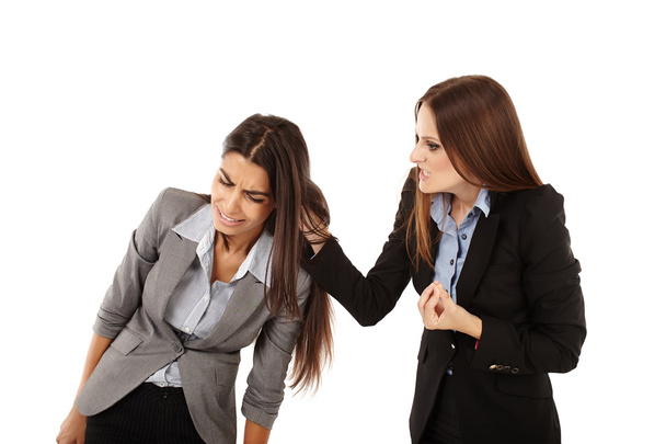 Businesswoman pulling colleague's ear - Fotó, kép
