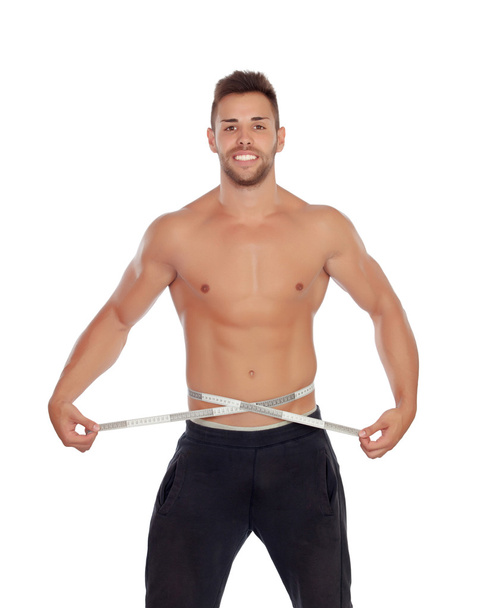 Muscled man with tape measure - Φωτογραφία, εικόνα