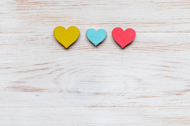 Wooden hearts on wooden background. Top view with copy space - Photo, Image