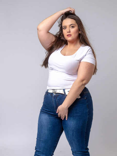 Plus Size Model with long hair posing in studio - Photo, image