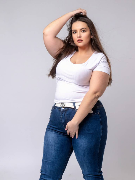 Plus Size Model with long hair posing in studio - Photo, Image