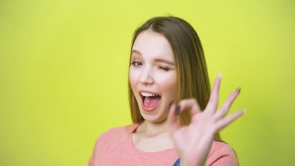Smiling blonde woman showing ok gesture - Video