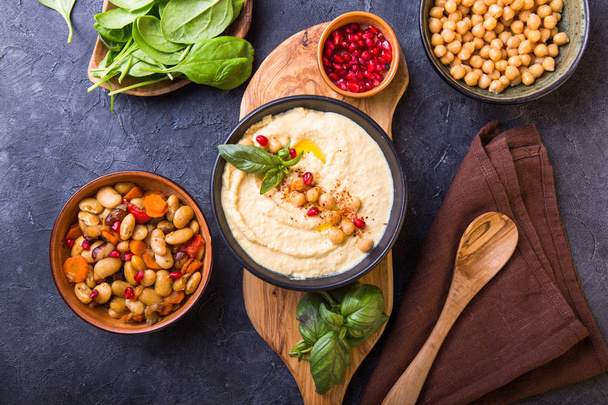 Mediterranean mezze board with  hummus, beans, spinach . top vie - Fotoğraf, Görsel