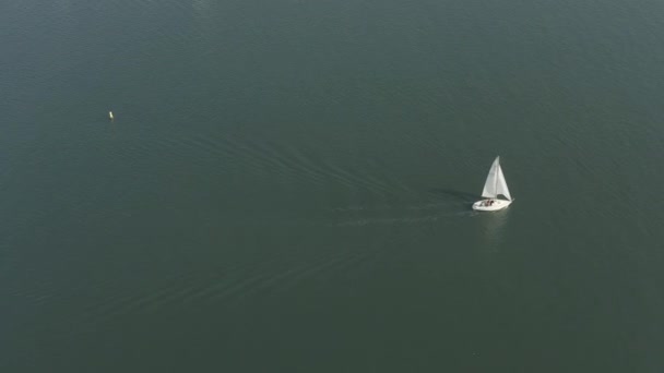 Aerial shot of a yacht sailing near the coast in California - Footage, Video