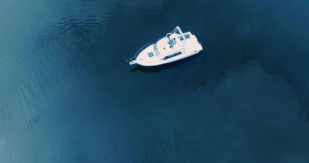 Aerial shot of beautiful blue lagoon at hot summer day with motorboat. - Φωτογραφία, εικόνα