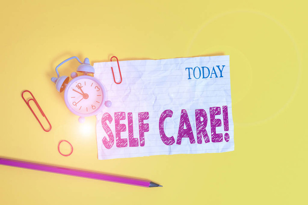 Word writing text Self Care. Business concept for practice of taking action to preserve or improve ones own health Alarm clock clips crushed note rubber band pencil colored background. - Photo, Image