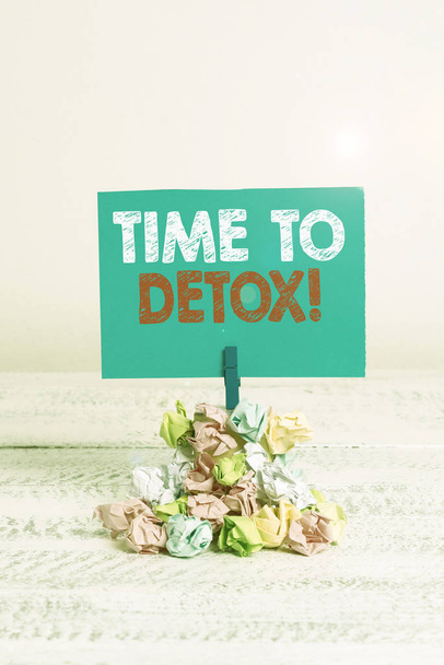 Writing note showing Time To Detox. Business photo showcasing when you purify your body of toxins or stop consuming drug Reminder pile colored crumpled paper clothespin wooden space. - Photo, Image