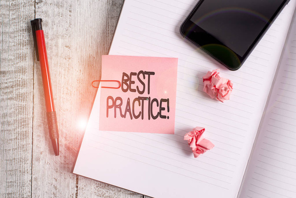Text sign showing Best Practice. Conceptual photo commercial procedures accepted prescribed being correct Thick pages notebook stationary placed above classic look wooden backdrop. - Photo, Image
