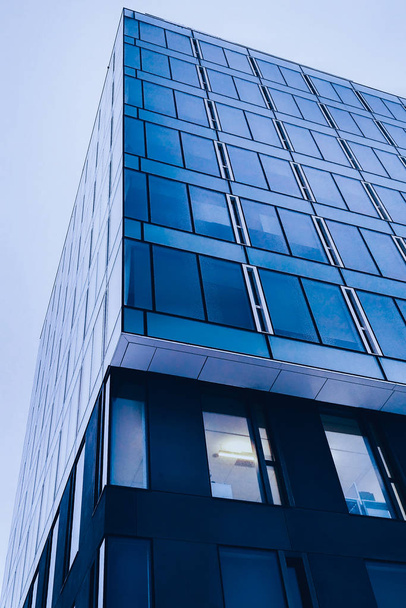 Classic blue glass office futuristic building in the city centre till the sky. - Foto, immagini