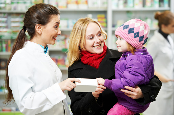 Pharmacy chemist, mother and child in drugstore - Foto, Bild