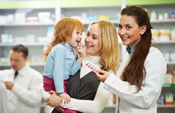 Pharmacy chemist, mother and child in drugstore - Фото, изображение