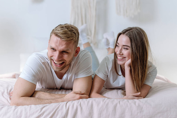 Young adult family spending morning in bedroom - Photo, Image