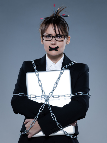 business woman chained to her her computer laptop - Fotoğraf, Görsel