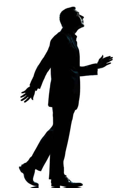 one business man walking looking up silhouette - Zdjęcie, obraz