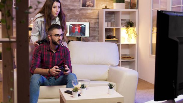 Man playing video games on television - Foto, imagen