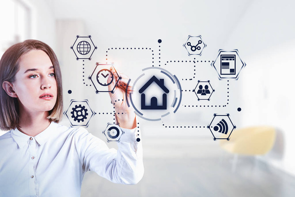 Young woman using futuristic smart home system - Foto, Bild