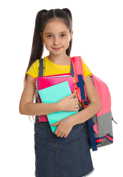 Little girl with school stationery on white background - Foto, Imagem
