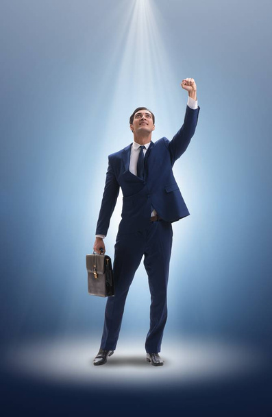 Businessman in the spotlight in business concept - Photo, Image