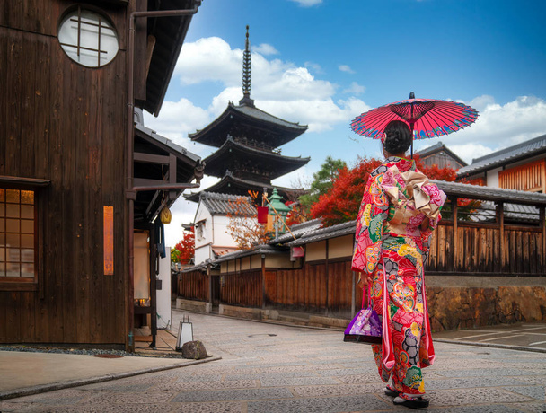 apanese girl walk in kyoto old market and wooded yasaka pagoda  - Photo, Image