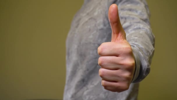 Man show thumbs up in camera. Closeup shot - Footage, Video