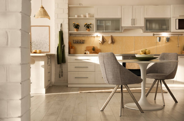 Modern kitchen interior with stylish white furniture. Space for  - Photo, image