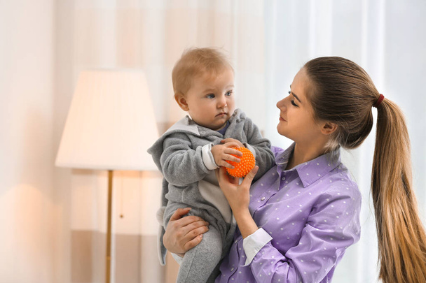 Teen nanny with cute little baby at home - Photo, Image