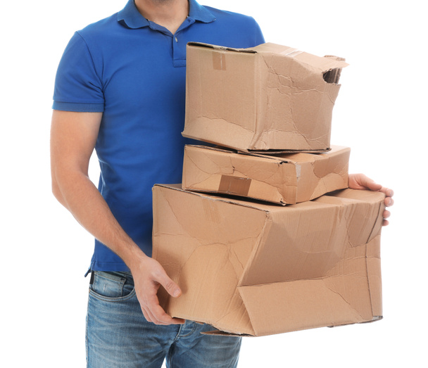 Courier with damaged cardboard boxes on white background, closeup. Poor quality delivery service - Foto, afbeelding