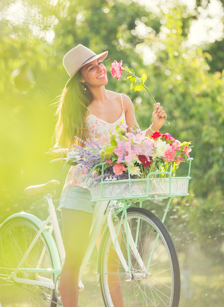 Beautiful young woman on bike - Φωτογραφία, εικόνα
