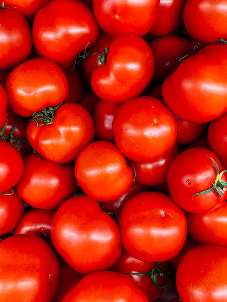 lots of red tomato to eat a background - Photo, Image