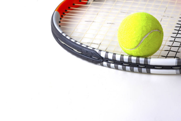 tennis ball and racket on white background - 写真・画像