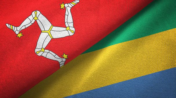 Isle of Mann ja Gabon kaksi lippua tekstiilikangas, kangas rakenne
 - Valokuva, kuva