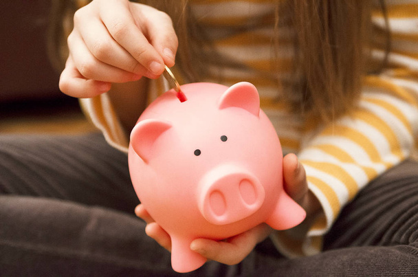 woman holding piggy bank in hand - Photo, Image